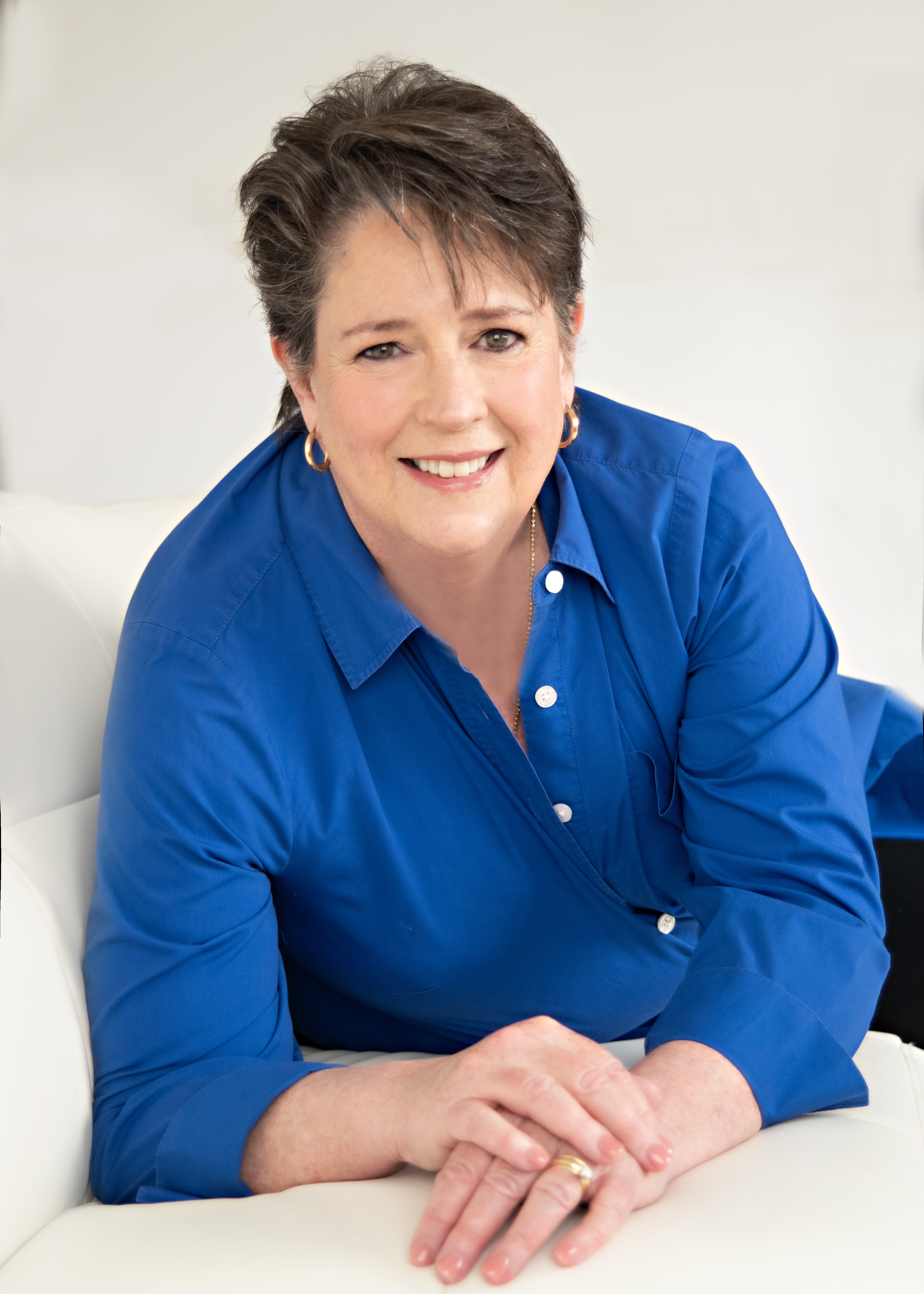 Professional woman portrait for personal branding, captured in warm natural light